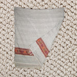 Beige shawl with red pattern