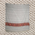 Beige shawl with red pattern