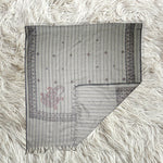 Grey shawl with dark grey pattern